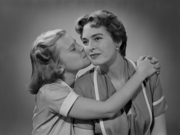 Girl Kissing Mother on Cheek